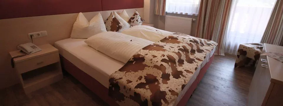 outdoor active zillertal outdoorvakantie oostenrijk tirol mayrhofen hotel landhaus carla slaapkamer