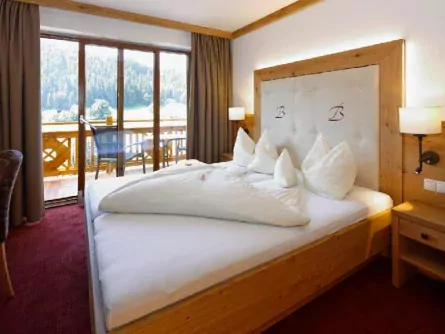 family fun brixental premium avontuurlijke gezinsvakantie oostenrijk families hotel berghof slaapkamer